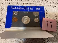 United States Proof Set coins in original blue packaging with 1970 labeling, showing front view of coin set