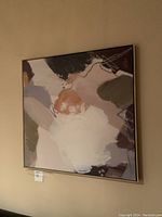 Frontal image showing the full framed abstract canvas artwork hanging on the wall with natural color tones.
