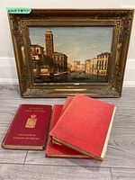 Overall lot showing oil painting in gilt frame and four antique books