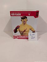 Front view of boxed Kid Flash statue from DC Collectibles showing character and packaging.