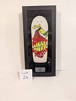 Frontal photo showing full framed Billy Ruff tech deck wall art with visible graphic design and plaque.