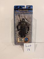 Haradrim Archer action figure in sealed packaging with visible character details and branding.