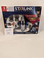 Front view of Nintendo Switch Starlink Battle for Atlas Starter Pack box showing the spaceship, Fox McCloud and Arwing figures inside.