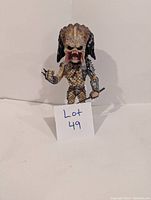 Single Predator bobblehead figure shown with detailed armor, weapon, and open mouth.