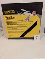 Front view of Stanley PoolTec vacuum hose box showing product name, specifications, and brand.