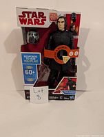 Full boxed Star Wars Kylo Ren talking figure with removable mask in original packaging showing branding and feature info.