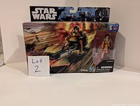 Full boxed view of Star Wars Ezra Bridger Speeder toy in original packaging showing speeder and figure.