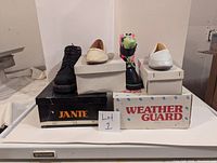 Photo of four pairs of shoes on top of their original boxes, showing each shoe and box condition.