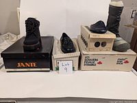 Lot of 5 vintage shoes/boots displayed on their original boxes with a sign reading 'Lot 9'