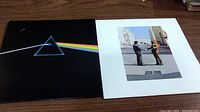 Photo showing both Pink Floyd album covers: The Dark Side of the Moon and Wish You Were Here.