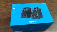 Front view of the sealed Logitech Z130 speakers retail box showing image of the two speakers and power output