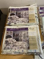 Packaged Bedroom Elegance Azur bedding and curtains showing front view of product packaging and set details.