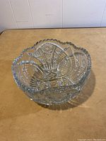 Top-down view showing the intricate star and geometric cut patterns inside the crystal bowl and scalloped edge.