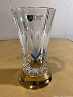 Front view of the clear crystal vase showing the Killarney Crystal Ireland label and 22CT gold finish sticker on the broad gold band base.