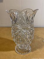 Clear crystal vase with pineapple cut pattern and scalloped rim