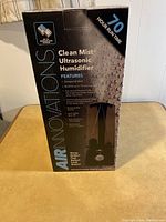 Box front showing 70 hour run time and key features including compact silent operation, automatic shut-off, and large water capacity.