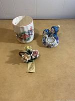 Three decorative candle holders on a plain surface, showing overall look and relative sizes.