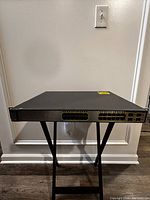 Front view of Cisco Catalyst 3750G switch showing 24 Ethernet ports and 4 empty SFP slots.