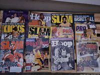 Photo of 10 basketball magazines featuring Kobe Bryant and other NBA stars. Covers include Slam, Sports Illustrated Hoop, Beckett Basketball, and Street & Smith's Pro Basketball magazines.
