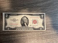 Front of series 1953B US $2 Red Seal Note, displaying serial number A73534936A and visible signs of wear.