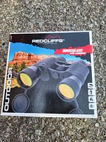 Photo of the retail box of Redcliffs outdoor binoculars with compass showing image and branding.