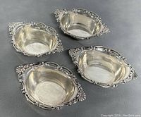 Four bowls arranged on dark background showing overall set and condition