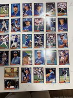 Photo showing 24 Toronto Blue Jays baseball cards from the 1992 Topps set depicting various players in different poses and uniforms.