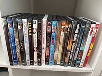 Photo of DVDs including Sex and the City Season 1 & 2, Out of Africa, 30 Best Dates, The Help, BBC Frozen Planet, Horrible Bosses, Divergent, Arthur, Ghost, Water for Elephants.