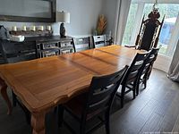 Full view of table fully extended with chairs