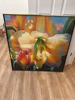 Full view of the large floral canvas painting featuring a blend of orange, white, and red flowers with a textured finish.