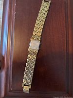 Full length back view of the vintage watch showing back of case and bracelet.