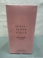 Front of the sealed pink box with product name and size