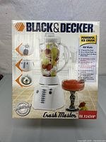 Front of box showing product image and key features like powerful ice crush, 450 watts, 12 speed pulse plus 3 blend settings, and 48 oz plastic jar.