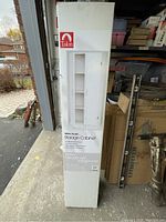 Boxed Talon storage cabinet standing upright in a garage setting.