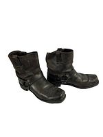 Pair of Frye harness boots side by side on white background showing wear and detail