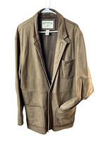 Front view of the men's Orvis leather jacket hanging on a hanger, showing the entire jacket with pockets and collar.