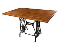 Full view of the DIY desk showing the wooden top and Singer wrought iron base.