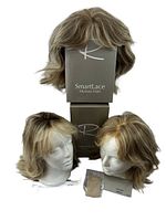 Three Jon Renau SmartLace human hair wigs displayed with boxes and receipt, showing overall set contents and included accessories.