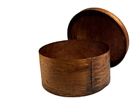 Open view of round wooden bentwood pantry box showing interior and lid.