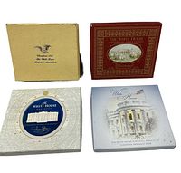 Four White House Christmas ornaments in original boxes, displayed from the top view showing distinct box designs for 1995, 2007, 2008, and 2009.