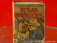 Front cover of the book showing the title and illustration of a Texas Ranger and horse.