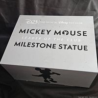 Closed box showing Disney fan club D23 Mickey Mouse milestone statue packaging.