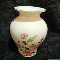 Front view of vintage Lenox Barrington floral vase on dark fabric background