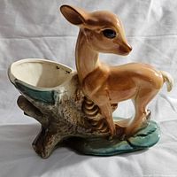 Front angle showing the full deer planter and tree stump opening