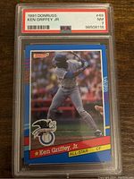 Front side of the 1991 Donruss Ken Griffey Jr. baseball card #49 showing the full color image of Griffey batting and PSA grading label.