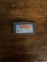Front side of Donkey Kong Country 3 Game Boy Advance cartridge showing label with game title and rating.