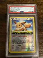 Front side of 2014 Pokémon XY Eevee Reverse Holofoil card graded PSA 5 showing card details and holofoil effect.