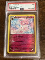 Front view of 2014 Pokemon XY Sylveon reverse foil card graded PSA 5 in protective slab showing artwork and text.
