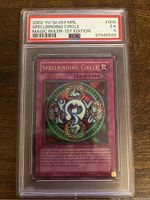 Front of Spellbinding Circle card showing artwork and text in PSA graded slab with grade 5 label.