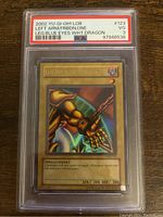 Front of a 2002 YuGiOh! Left Arm of the Forbidden One LOB-123 card in a PSA graded case showing a gold armored left arm illustration and the card's stats.
